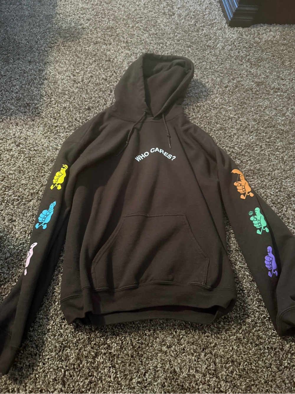 Unisex Rex Orange County 'Who Cares?' Hoodie with Colorful Sleeve Graphics.